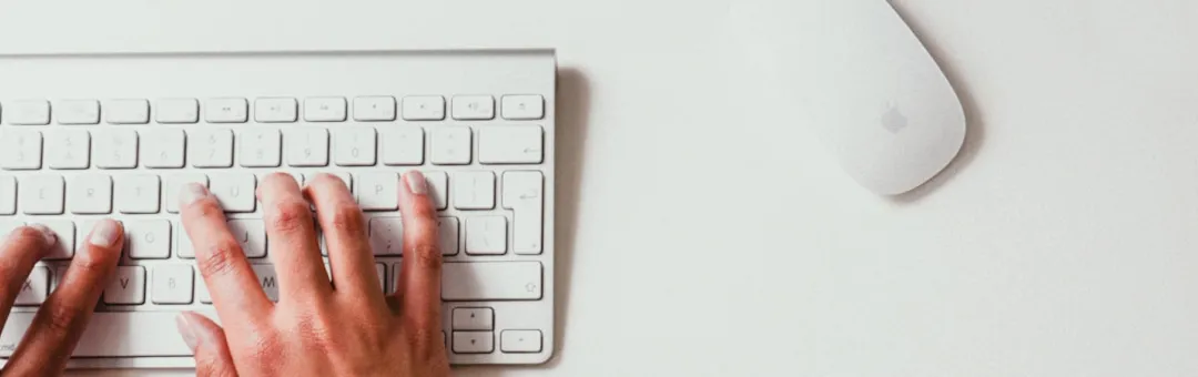 hand typing on keyboard